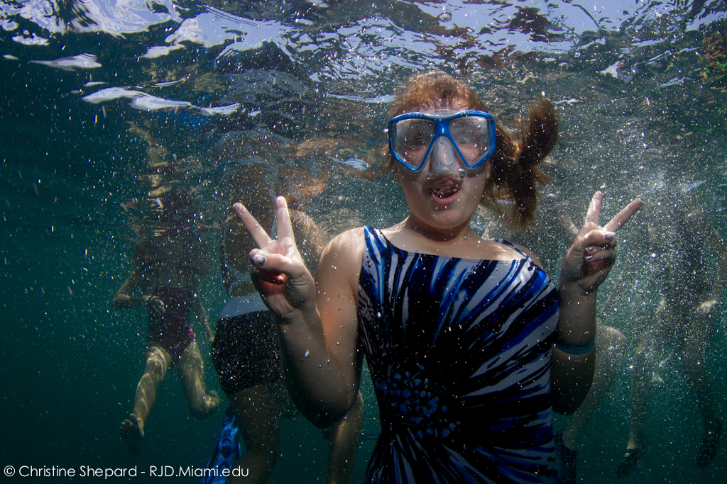 A South Broward High School Student bursts with excitement in her underwater portrait during a field trip with RJD.