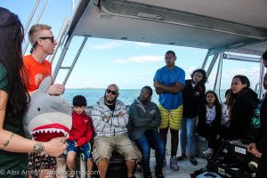 Trip leader and SRC Master’s student Jake tells students about the workup process for a shark and uses Sharky, the stuffed shark, to demonstrate the procedures